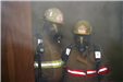 Fire Fighters Wearing a Smoke Protection Mask