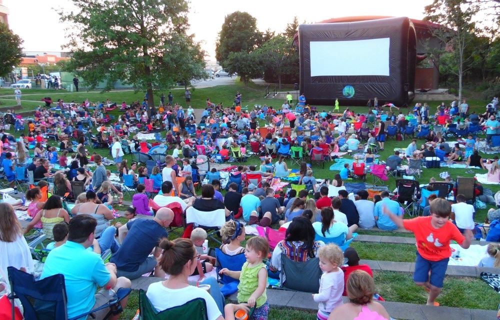 People gather to watch a movie at Dogwood Park.