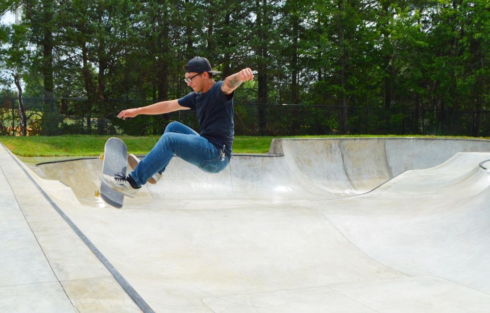 A skateboarder rides the wall at Park View Skate Park.