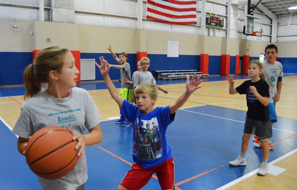 Children play basketball at Cane Creek Gymnasium.