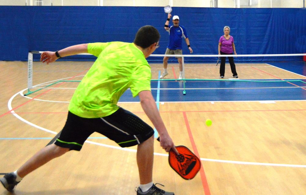 People play pickleball at Cane Creek Gymnasium