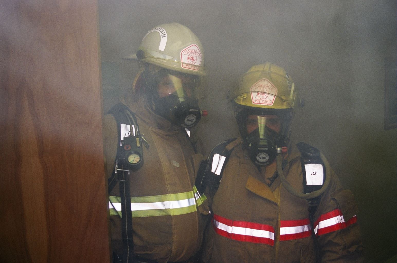 Fire Fighters Wearing a Smoke Protection Mask