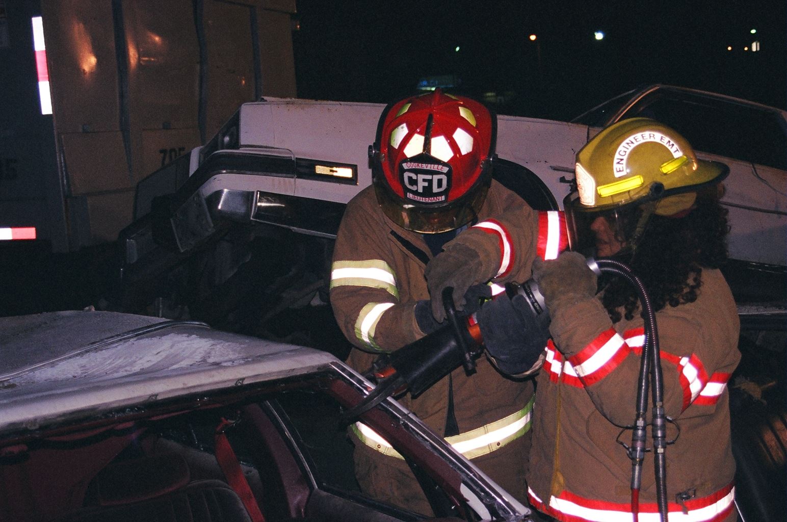 Fire Fithers Braking a Car Glass