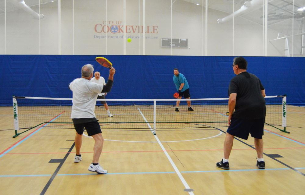 People play pickleball at Cane Creek Gymnasium